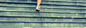 woman running up stairs
