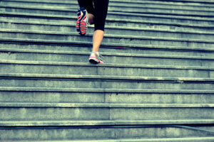 woman running up stairs